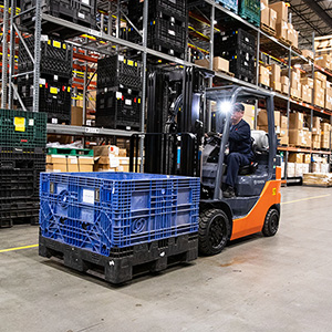 Toyota IC Cushion Forklift carrying a crate