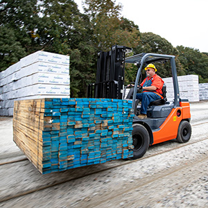 Toyota IC Pneumatic Forklift moving lumber