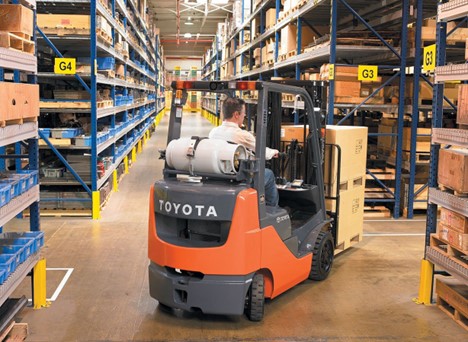 An Internal Combustion Cushion Tire Forklift with a propane tank